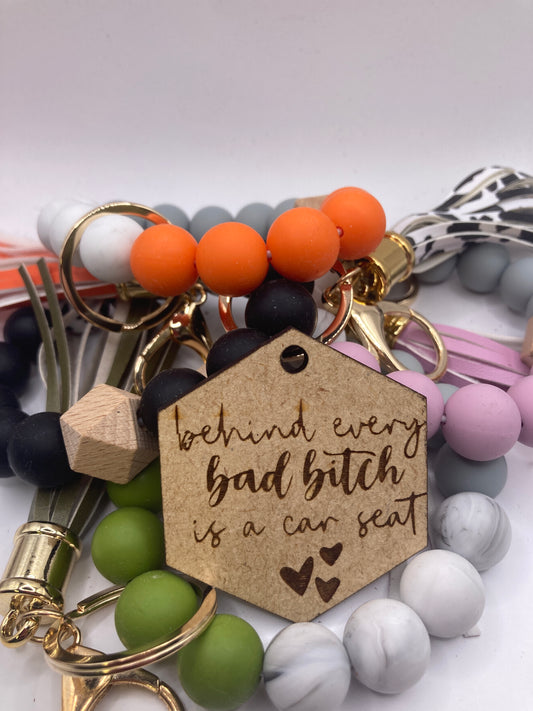 Behind Every Bad Bitch is a Car Seat with Hearts Accessory Token