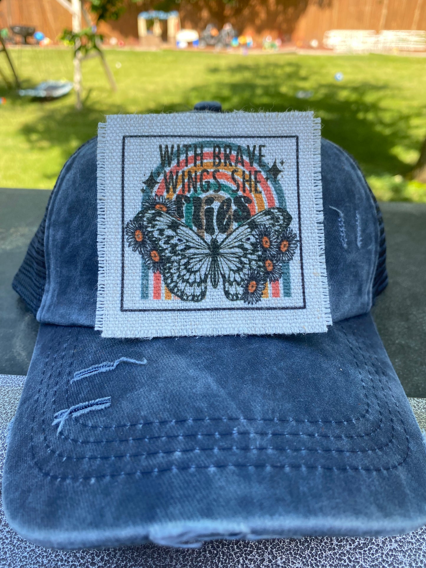 With Brave Wings She Flies Hat Patch